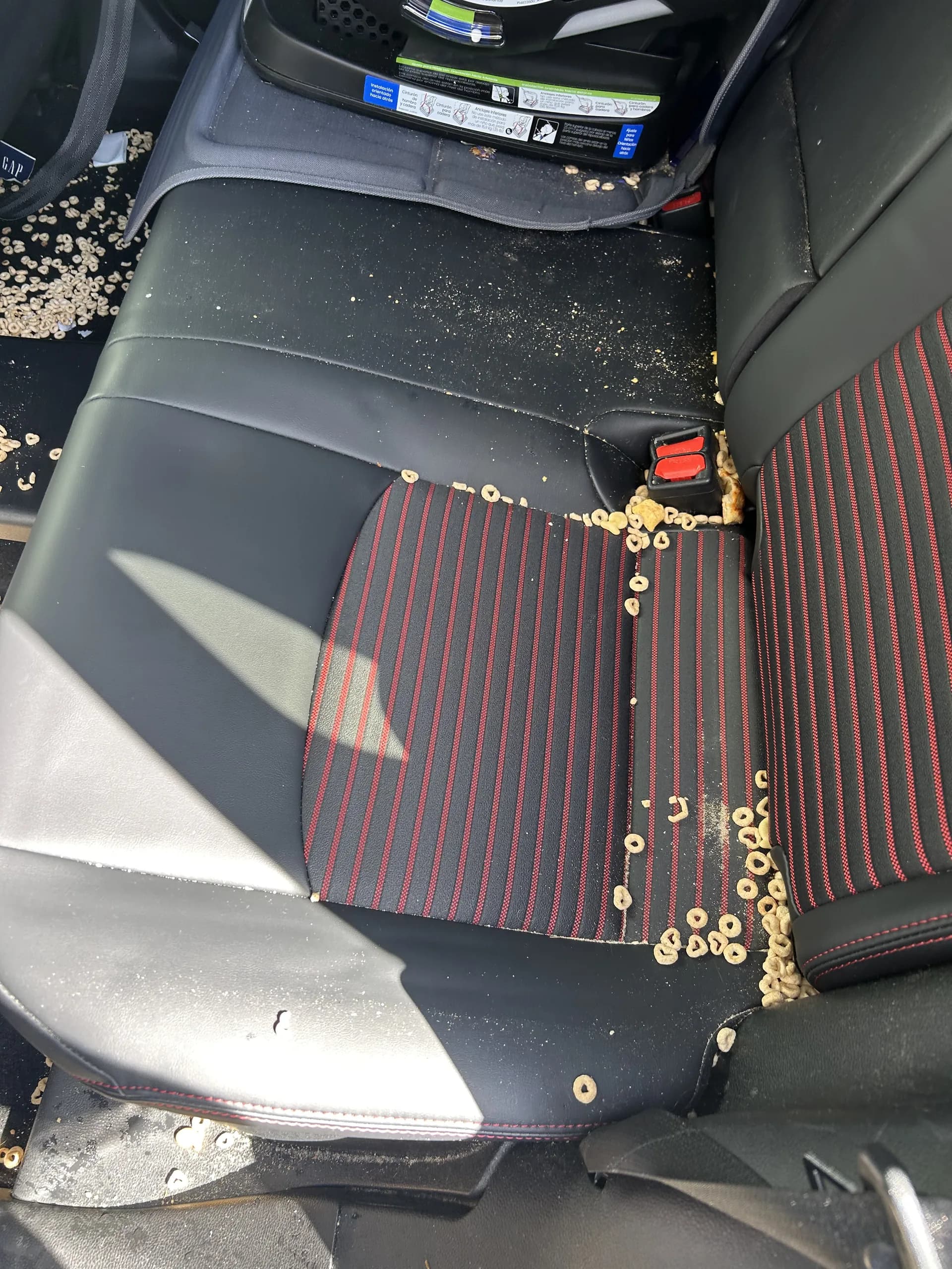 Toyota RAV4 rear seats covered in spilled cereal before a Golden Bay interior detail in San Francisco